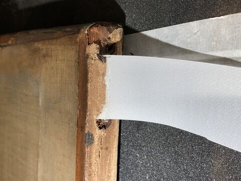 Cloth tab in between canvas