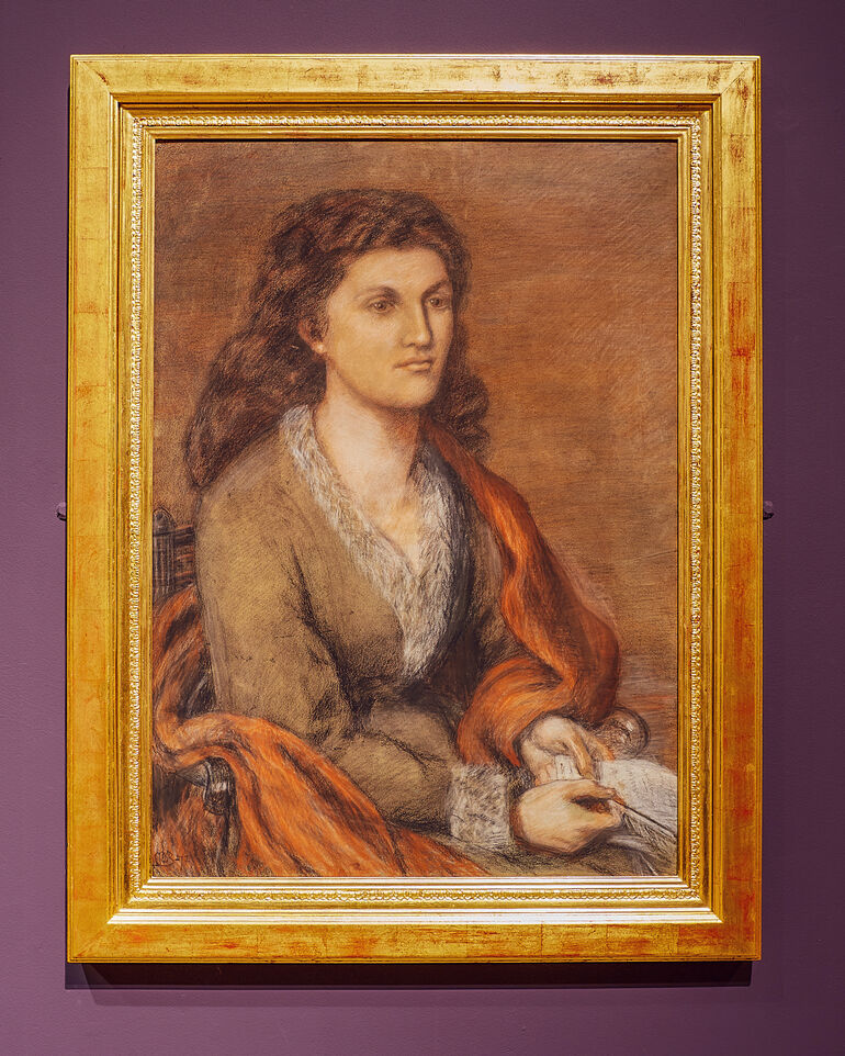 Drawn portrait of Mathilde Blind, a woman with brown hair wearing a brown dress with fur trim and an orange sash