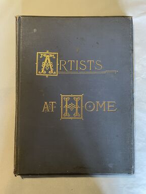 Photo of a front cover of a book, the title is in gold and the book cover is dark blue.