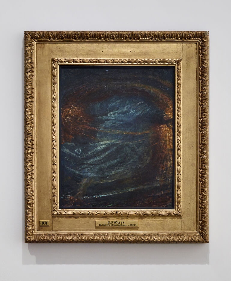 Photograph of an oil painting in a carved, gilt frame on a white background. The painting is of an abstract blue cloaked figure surrounded by swirls of gold and orange.