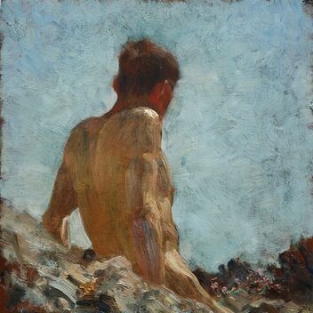 A man reclines on the rocks