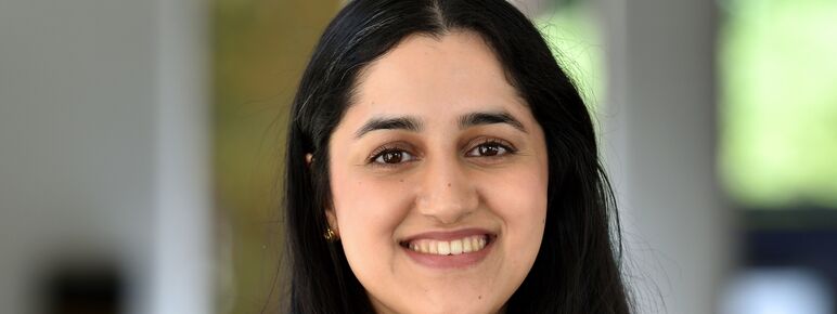 Photograph of lady with long dark hair smiling