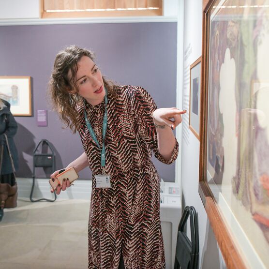 Woman pointing at a painting