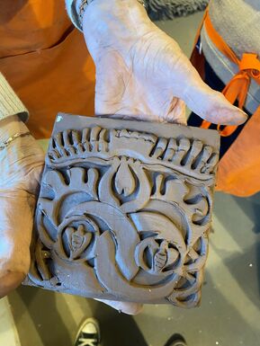 Close-up of detailed clay tile with pattern