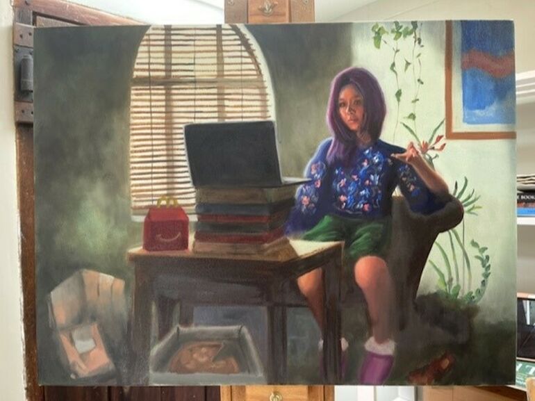 An oil painting of a young woman with purple hair sat on a chair next to a table, on it a laptop is balanced on top of several books, and a MacDonalds happy meal box sits next to it.