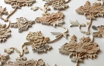 Photo of floral ceramic pieces laid on a flat surface