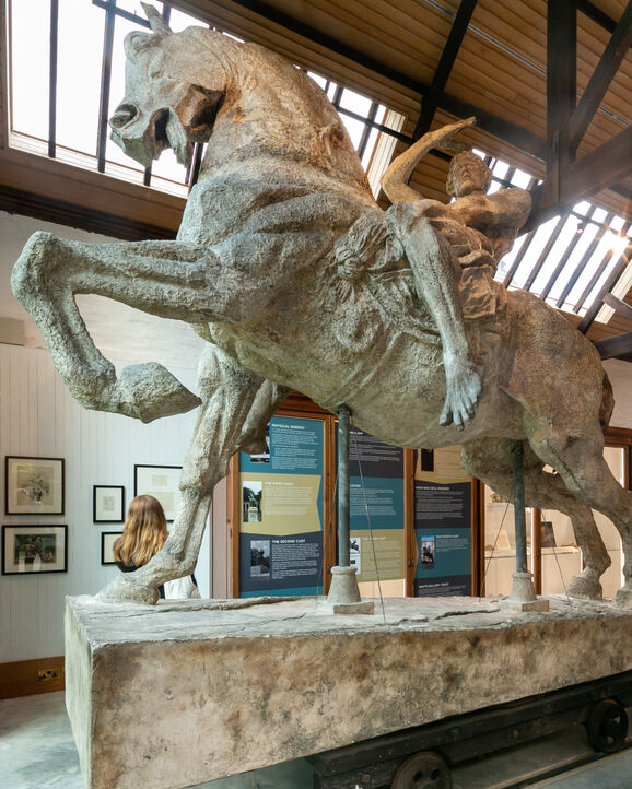 Plaster model of man riding a horse in a Gallery setting