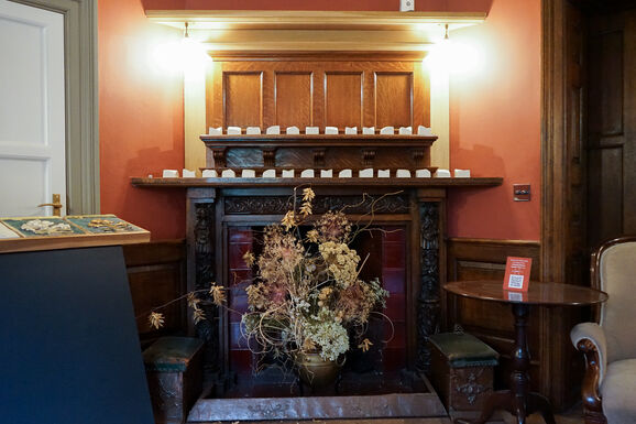 Photo of small porcelain sculptures on a mantlepiece