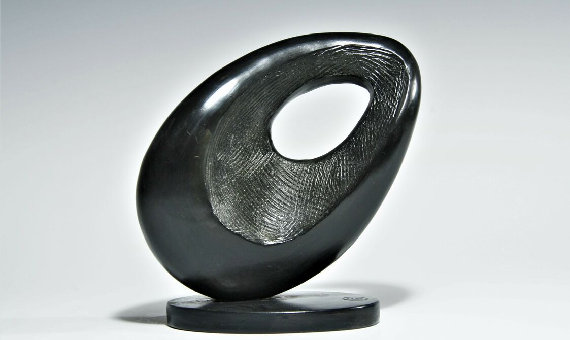 an abstract semi circle shape with a circle cut out the centre