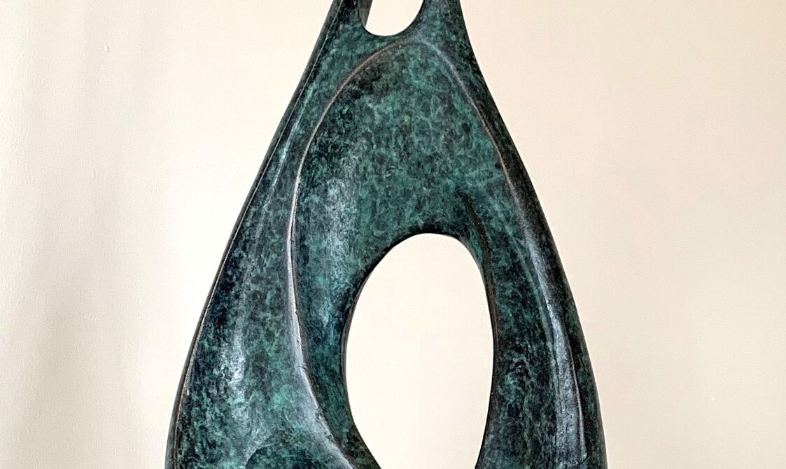 An abstract tear drop shape made of bronze