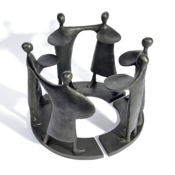 Six black abstract figures arranged in a circle