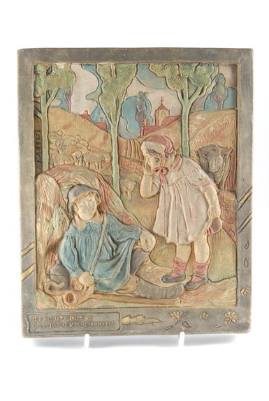 A ceramic plaque with a boy in blue leaning on cattle