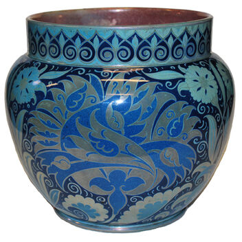 Squat jardiniere with short straight neck. Decorated in moonlight lustre colours, with floral and leaf decoration.