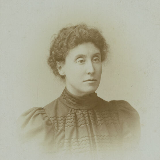 A photo portrait of Evelyn De Morgan. Her hair is up and she wears a black dress.