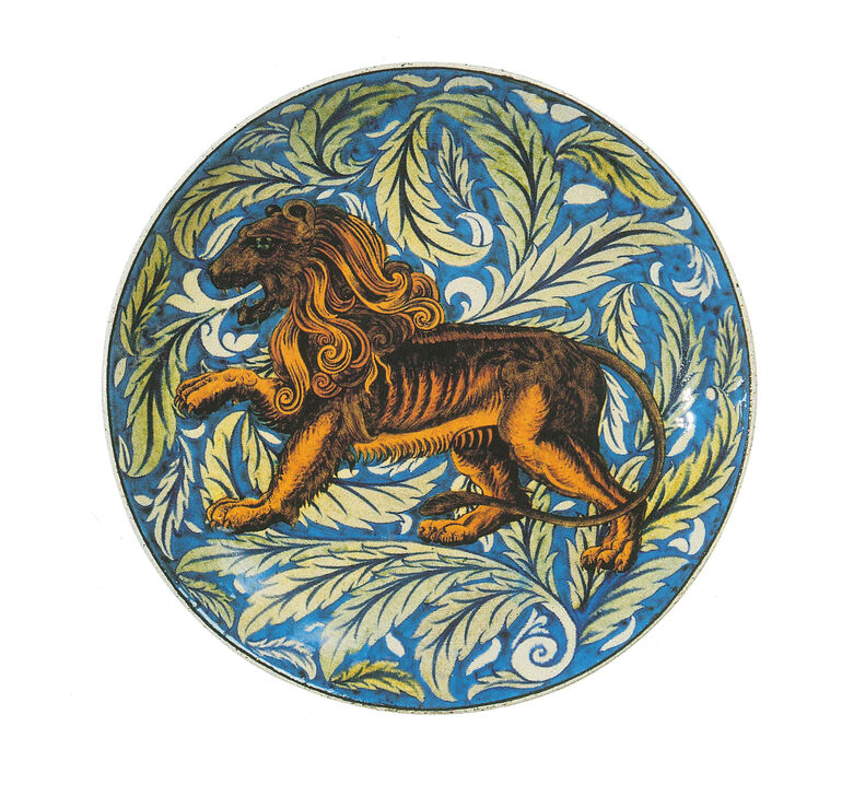 Shallow Earthenware dish. Decorated with a ferocious lion striding across a background of pale leaves on a turquoise ground.