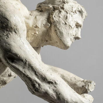 Plaster model side profile of man with arms outstretched