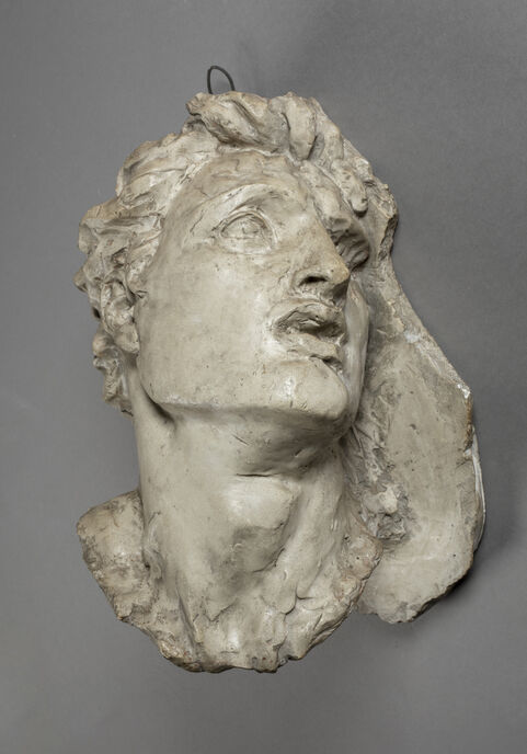 A plaster study head of a man looking distraught
