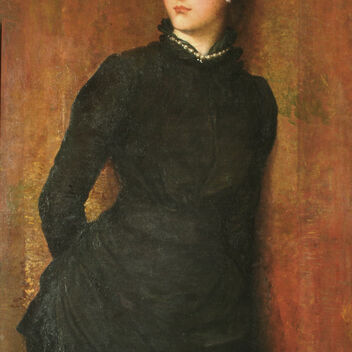 Portrait of a women with her head to the side in a dark long-sleeved dress
