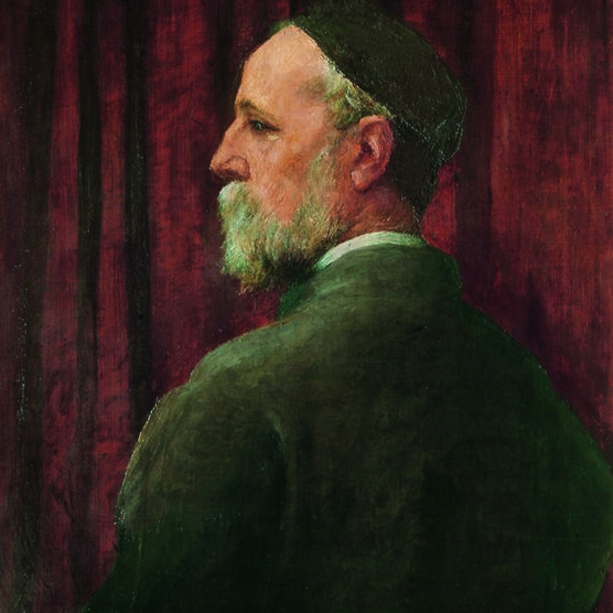 Watts is turned away from us but looks over his shoulder so we see his profile, he wears a black skull cap.