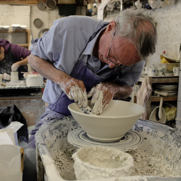 Jonathan Chiswell Jones working on the potters wheel