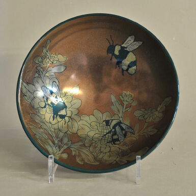 Bronze coloured lustreware bowl with yellow flowers and bees