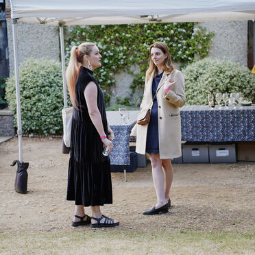 A photograph of two women stood outside the Historic Galleries talking