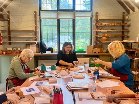 A group work with clay in the Pottery Studio