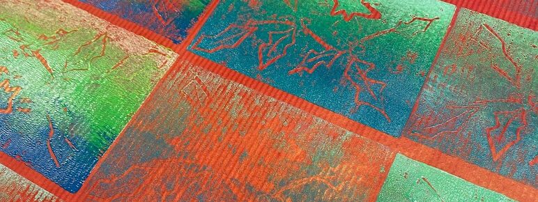 Handprinted Christmas wrapping paper with red and green festive pattern