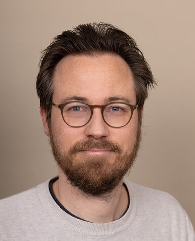 A portrait of Jethro Crabb smiling.