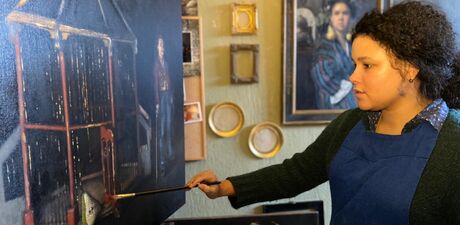 Nneka paints a large scale painting