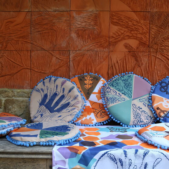 A collection of circular multicoloured decorative cushions