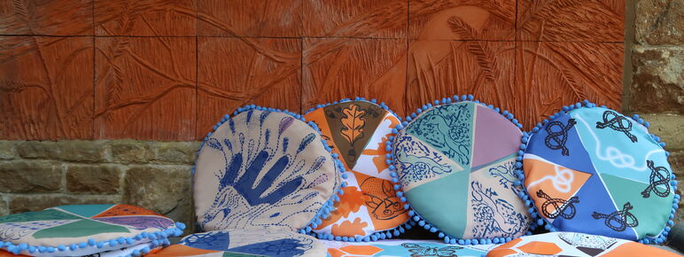 A collection of circular multicoloured decorative cushions