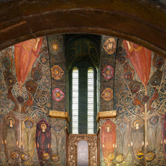 Chapel interior from the doorway, the walls are covered with symbols and Celtic designs