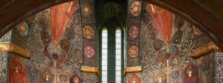 Chapel interior from the doorway, the walls are covered with symbols and Celtic designs