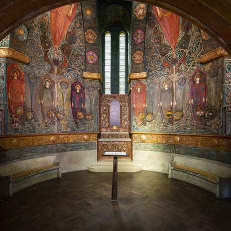 The inside of the chapel with intricate and colourful panels