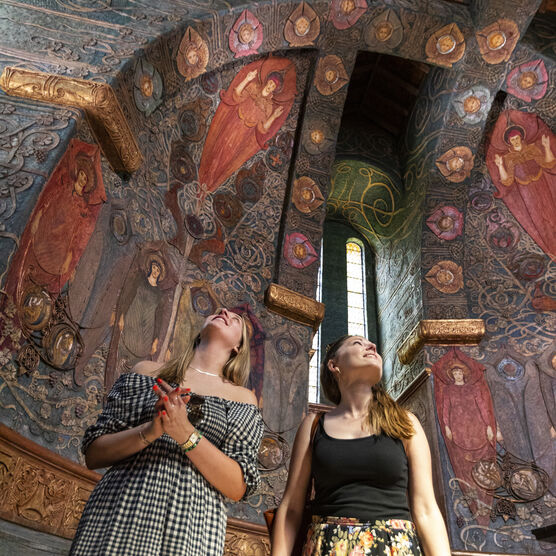 Visitors inside Watts Cemetery Chapel