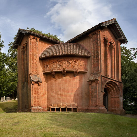 A terracotta celtic-style chapel with decorated tiles