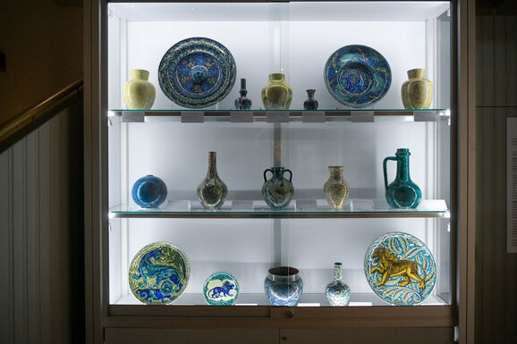 Ceramics on display in glass cabinet