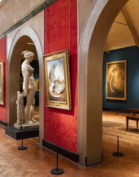 Inside of gallery with paintings and sculptures