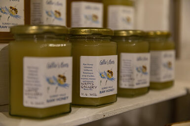 Jars of honey in a row