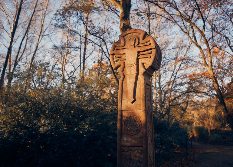 A celtic style cross in the woodlands