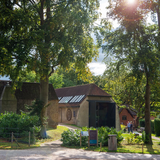 Outside of Watts Gallery - Artist's Village with trees and buildings