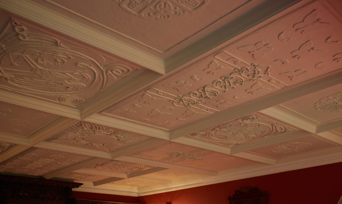 White ceiling with decorative symbols