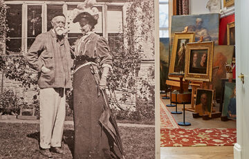 A black and white photo on the wall, featured are two people outside a house