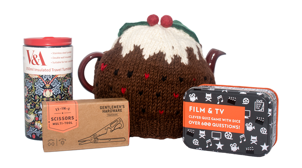 Product photograph of 4 items. On the far left of the image is a travel mug which has a blue floral pattern by William Morris on it, next to it on the middle-left is a brown box with a multi-scissors tool inside, on the middle-right is a teapot with a tea cosy on which looks like a Christmas pudding, and on the far right is a quiz card game in a black box with white television and audio symbols on.