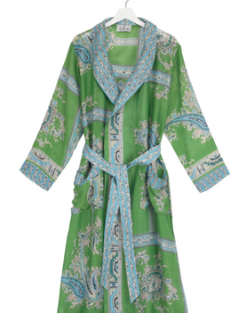 A long green gown with blue patterns and a waist tie