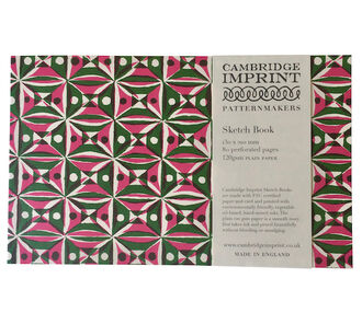 A sketchbook made by Cambridge Imprint with a colourful red and green pattern on the front cover
