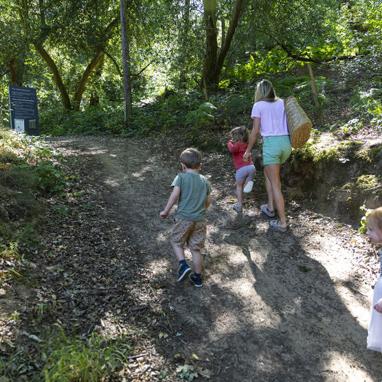 A family walk up the slope into the Verey Playwood