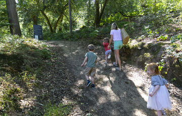 A family walk up the slope into the Verey Playwood