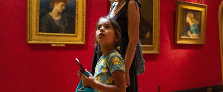 Mum and daughter look around gallery